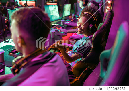 Enjoy a fun gaming session with friends in a modern esports lounge filled with creativity 131392981