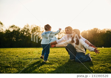 Mother with daughter and son are together on the field 131393520