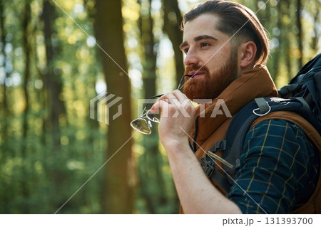 Bearded man is in the forest at daytime 131393700