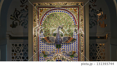 Replica Of Peacock Mosaic Wall From Mor Chowk Or Peacock Square Of Udaipur City Palace. Peacocks Have Been Crafted With 5000 Pieces Of Glass, Which Shine In Green, Gold, And Blue Colours 131393744