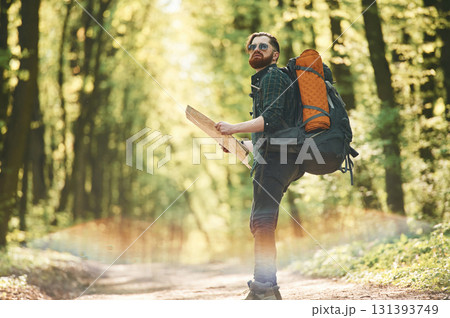 Colorful lens effect. Bearded man is in the forest at daytime 131393749