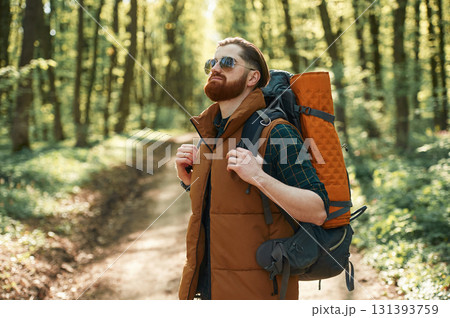 Bearded man is in the forest at daytime Bearded man is in the forest at daytime 131393759