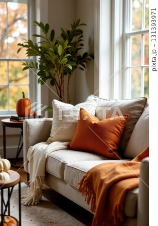 Cozy autumn living room decorated with pumpkins and warm blankets Cozy autumn living room decorated with pumpkins and warm blankets 131393971