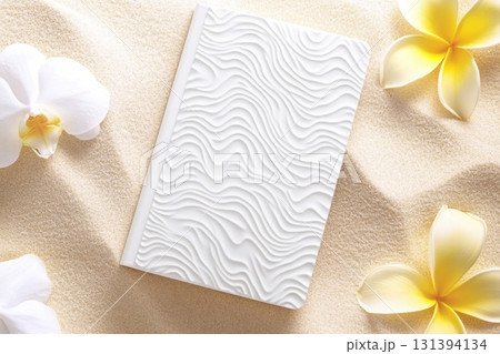 Minimalist design mockup showcasing a blank white book placed on a soft sand-colored background with delicate flowers around it, perfect for creative projects Minimalist design mockup showcasing a blank white book placed on a soft sand-colored background with delicate flowers around it, perfect for creative projects 131394134