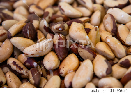 Close-up Many delicious Brazil nuts as background, top view. A backdrop for advertising nuts and dried fruits. Close-up Many delicious Brazil nuts as background, top view. A backdrop for advertising nuts and dried fruits. 131395634