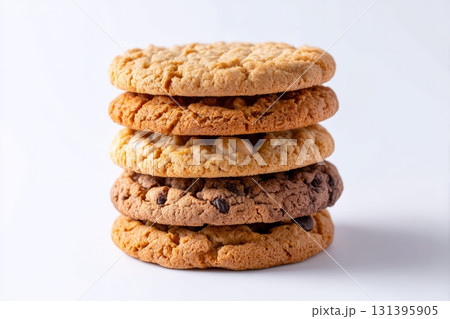 A delicious stack of cookies showcases different flavors, including a rich butter variety, against a bright white background 131395905