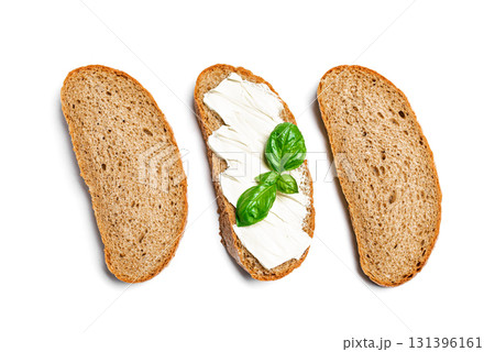 Bread with butter and slices of bread on white 131396161