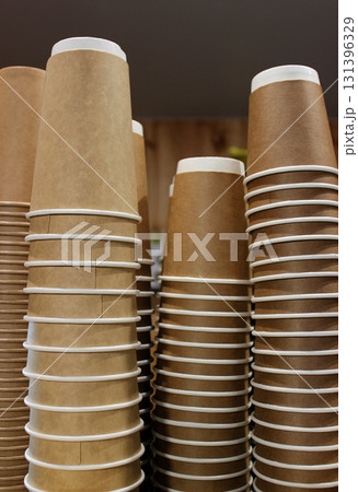 Vertical Photo Of Various Cardboard Cups For Coffee Are Stacked  131396329