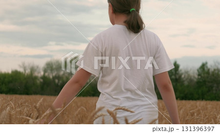 teenage girl walking wheat field, agriculture, child enjoying nature wheat field, child girl farmer daughter walking field touching ears wheat, freedom childhood dream, childhood outdoors, walk teenage girl walking wheat field, agriculture, child enjoying nature wheat field, child girl farmer daughter walking field touching ears wheat, freedom childhood dream, childhood outdoors, walk 131396397