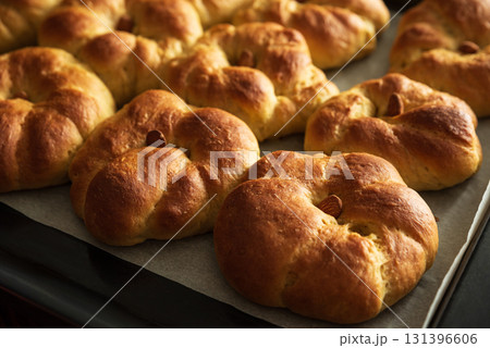 Freshly baked pumpkin-shaped sweet buns with almonds. Thanksgiving celebrating 131396606