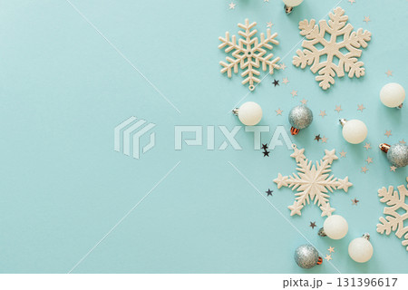 White Christmas Ornaments and Snowflakes on Light Blue Background White Christmas Ornaments and Snowflakes on Light Blue Background 131396617