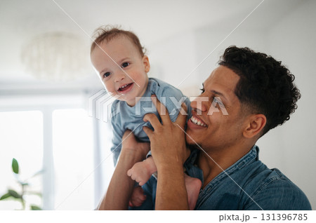 Father and small toddler son. Dad hodling and kissing boy. Father and small toddler son. Dad hodling and kissing boy. 131396785