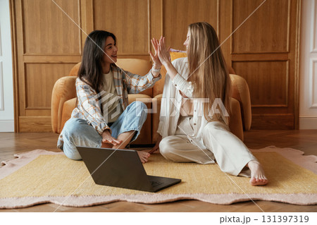 Happy playful free moments. Two young female best friends are indoors 131397319