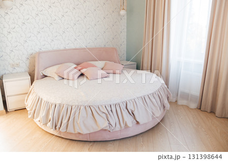 The bedroom interior of a contemporary bedroom with a round bed 131398644
