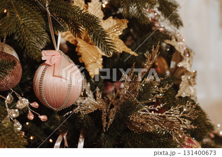 Close-up of Christmas Tree with Gold Decorations and Balls Close-up of Christmas Tree with Gold Decorations and Balls 131400673
