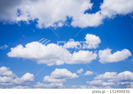 Beautiful white fluffy clouds in deep-blue sky 131400830