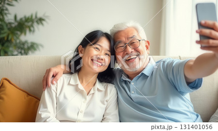 Happy older couple taking a selfie 131401056