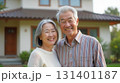 Happy elderly couple and their home 131401187