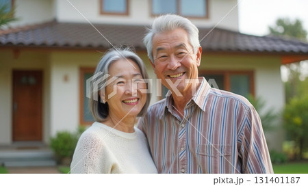 Happy elderly couple and their home 131401187
