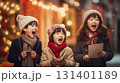 Happy children singing christmas carols 131401189