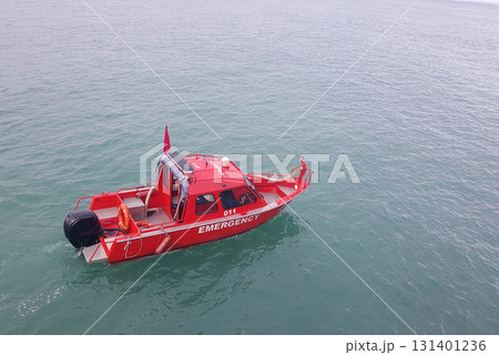 Red boat on blue sea background Red boat on blue sea background 131401236