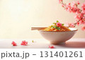 Beautiful bowl with noodles and flowers with copy space 131401261