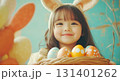 Cute little girl with easter eggs 131401262