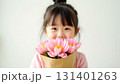Cute child with pink flowers for mothers day 131401263