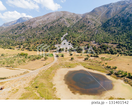 Drying lake in mountain village Omalos in western Crete. Drying lake in mountain village Omalos in western Crete. 131401542