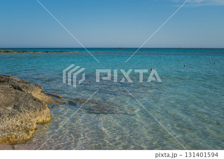 Red Safety Buoys Floating in Clear Blue Water at Rocky Entrance of Elafonisi Beach, Crete Red Safety Buoys Floating in Clear Blue Water at Rocky Entrance of Elafonisi Beach, Crete 131401594