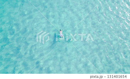 Young man swimming with mask in crystal clear turquoise sea water. 131401654