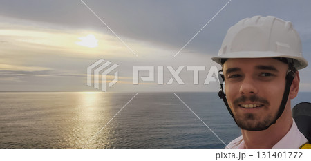 Sailor officer in white helmet, job on ship with sea background with copy space. Sailor officer in white helmet, job on ship with sea background with copy space. 131401772