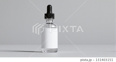 Clear glass dropper bottle with blank white label on gray - ai generated 131403151