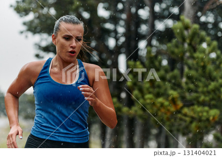 Unstoppable: A Determined Athlete Trains Through the Rain in Pursuit of Marathon Glory Unstoppable: A Determined Athlete Trains Through the Rain in Pursuit of Marathon Glory 131404021