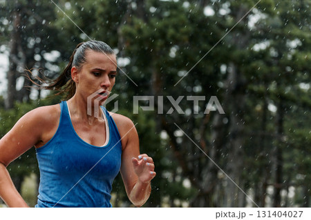 Unstoppable: A Determined Athlete Trains Through the Rain in Pursuit of Marathon Glory 131404027
