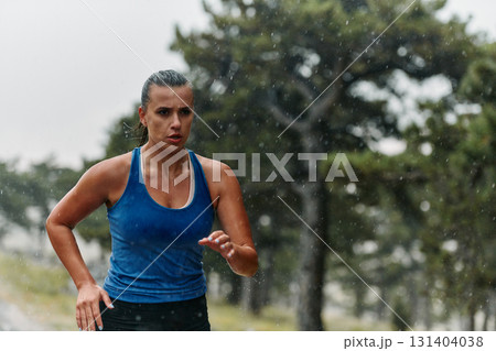 Unstoppable: A Determined Athlete Trains Through the Rain in Pursuit of Marathon Glory 131404038