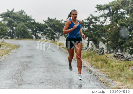 Unstoppable: A Determined Athlete Trains Through the Rain in Pursuit of Marathon Glory 131404039