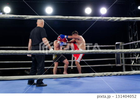 Fierce boxing match showcases athletes' power and skill. 131404052