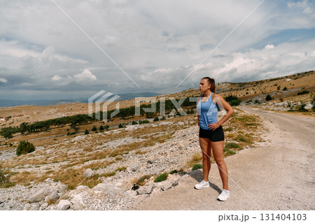 Determined Woman Athlete Preparing for Morning Run 131404103