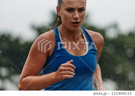 Unstoppable: A Determined Athlete Trains Through the Rain in Pursuit of Marathon Glory 131404115
