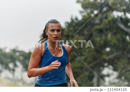 Unstoppable: A Determined Athlete Trains Through the Rain in Pursuit of Marathon Glory 131404130
