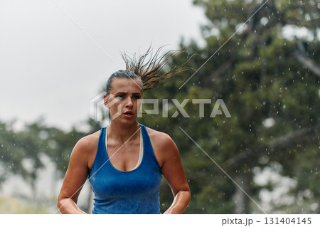 Unstoppable: A Determined Athlete Trains Through the Rain in Pursuit of Marathon Glory 131404145