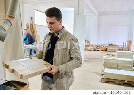 Production Manager Demonstrating Woodcraft Techniques to Employee for Decorative and Residential Items Production Manager Demonstrating Woodcraft Techniques to Employee for Decorative and Residential Items 131404162