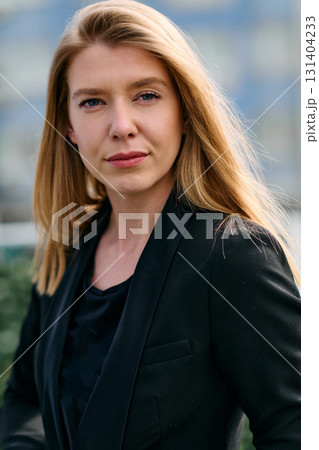 Portrait of a Stylish Business Blonde Posing on Terrace in Urban Cityscape. Portrait of a Stylish Business Blonde Posing on Terrace in Urban Cityscape. 131404233