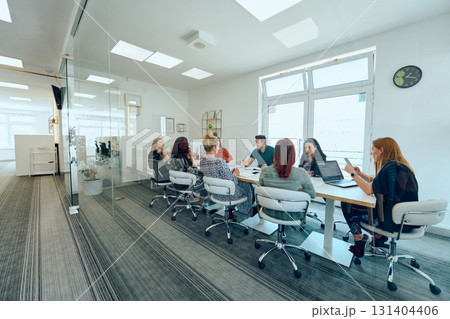 Diverse Business Team Discussing Projects in a Modern Glass Office. Diverse Business Team Discussing Projects in a Modern Glass Office. 131404406