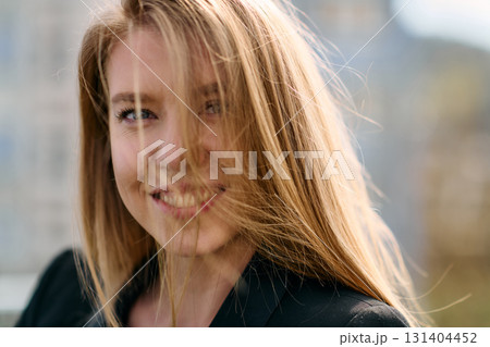 Portrait of a Stylish Business Blonde Posing on Terrace in Urban Cityscape. 131404452