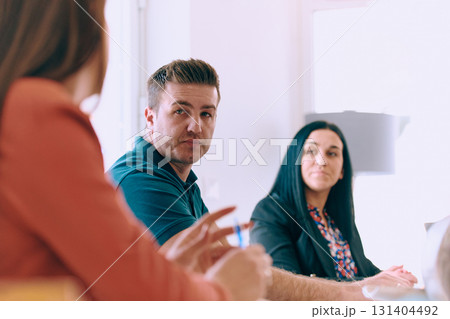 Diverse Business Team Discussing Projects in a Modern Glass Office. Diverse Business Team Discussing Projects in a Modern Glass Office. 131404492