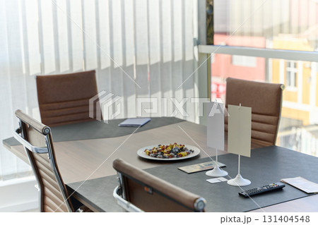 Modern Office Interior with Wooden Furniture, Conference Table, and Computers Modern Office Interior with Wooden Furniture, Conference Table, and Computers 131404548