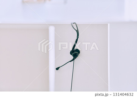 Close up of Headphones Awaiting the New Workday in the Call Center. 131404632