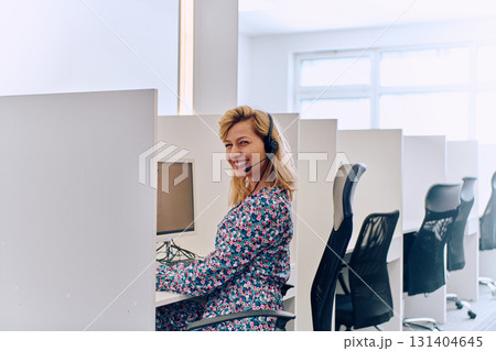 Female Call Center Agent Providing Customer Support and Assistance. 131404645